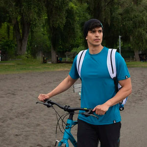 Man wearing Joob beanie and tshirt riding bike